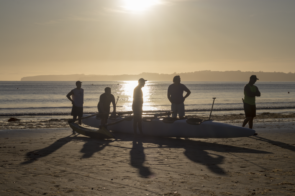 Mens team getting ready to start canoeing